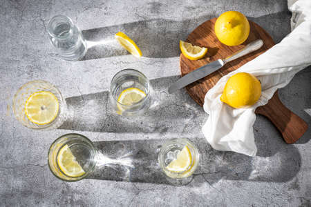 Refreshing lemon water. Glasses with water and lemon slices. detox drinks