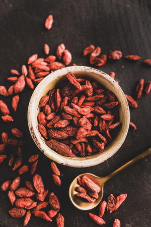 Close-up of goji berries on a black backgroundの写真素材