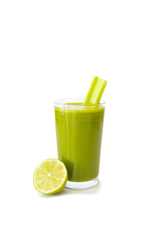 Vibrant green detox juice made from kale, celery, lemon, ginger, and green apple, placed on a white background with space for text.の写真素材
