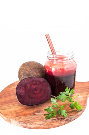 A vibrant beetroot smoothie served in a clear glass, showing its deep red color and thick texture. Known for its antioxidant, anti-inflammatory, and blood pressureâsupporting benefits, this drink is perfect for health and wellness content.の写真素材
