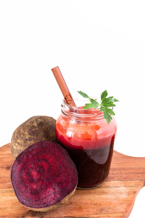 A vibrant beetroot smoothie served in a clear glass, showing its deep red color and thick texture. Known for its antioxidant, anti-inflammatory, and blood pressureâsupporting benefits, this drink is perfect for health and wellness content.の写真素材