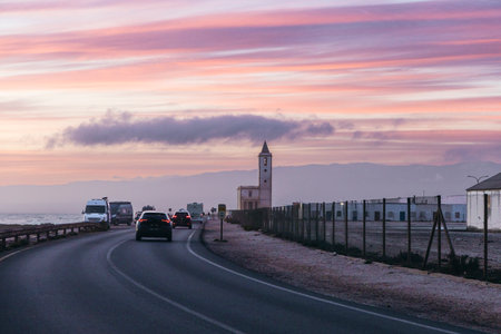 A dreamy sunset scene from the Cabo de Gata-NÃ­jar Natural Park in AlmerÃ­a, Spain, featuring a...