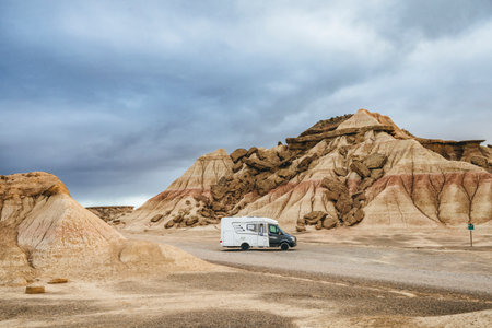 Motorhome parked in the Bardenas Reales Natural Park, Navarra, Spain. Road trip and van life adventure through the arid desert landscape of northern Spain.の写真素材
