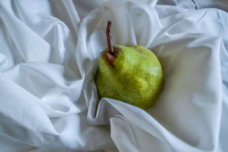 cut bright red orange half grapefruit in the sun lightの写真素材