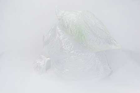 Transparent inflated plastic crumpled blank cellophane bags on a white background. Ecology concept