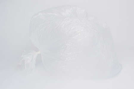 Transparent inflated plastic crumpled blank cellophane bag on a white background. Ecology concept