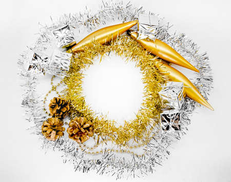 Beads, baubles, three bumps, toys, bumps, circle of silver, yellow, golden tinsel. Christmas concept for textの写真素材