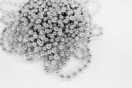 beads, chain of balls on a white backdrop. Christmas concept.の写真素材