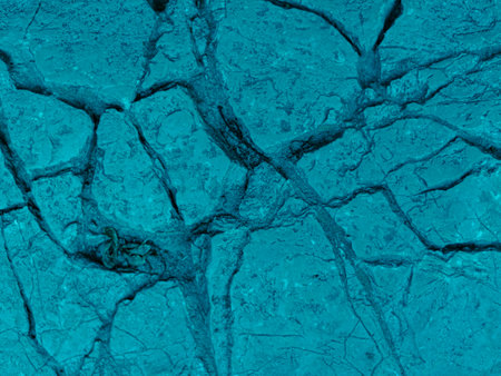 Rough textured light turquoise cosmic blue matte abstract stone with cracks and relief background. Wallの写真素材
