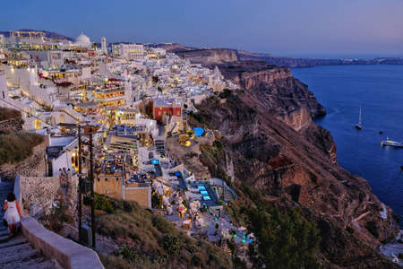 Panoramic view of the beautiful island of Santorini while the sun is settingの写真素材