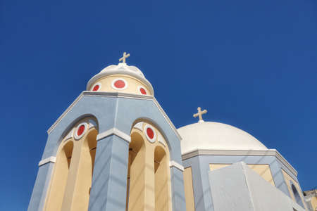 Santorini island, Greece. Greek orthodox church with blue skyの写真素材