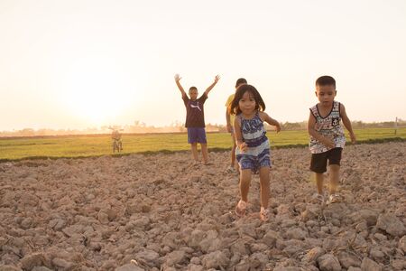 The childrens are playing in the fieldの写真素材