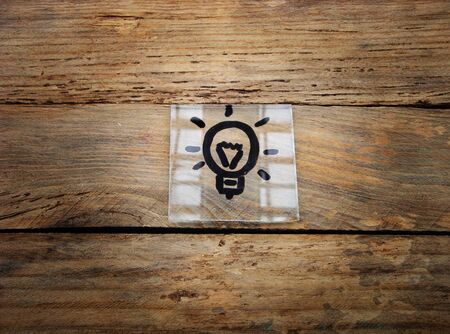Idea. Lamp on wood Background. Place for text.Idea.の写真素材