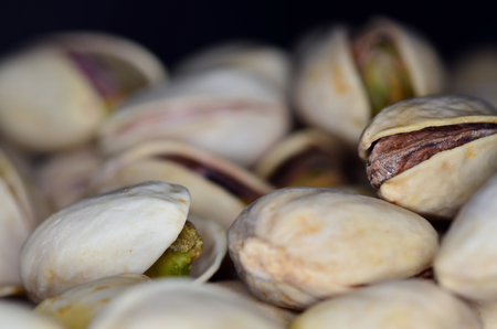 Pistachios in the black background, macro closeupの写真素材