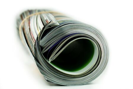 Some print magazines or catalogs, rolled upの写真素材