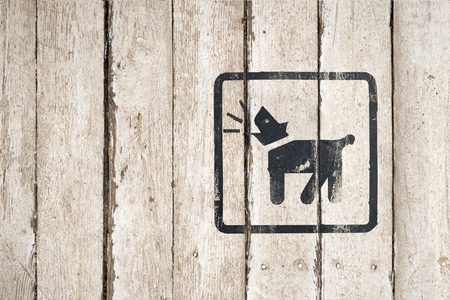 Guard dog inside icon. Part of a series. Dog Barking icon. Button image on wooden background. Dog Barking icon. Button image on wooden backgroundの写真素材