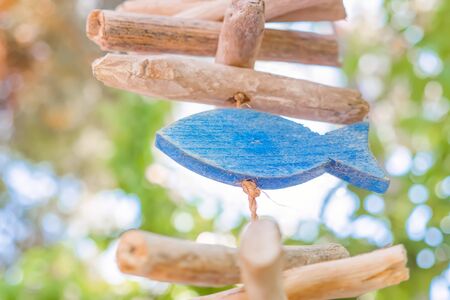Wooden fish simbol. Wooden fish hanging on the rope. Fish symbolizing fish food. Fish sign of faith....