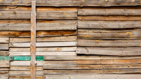 Brown rustic wooden texture background. Facade of a log house, copy space. Wooden texture background Wall of blockhouseの写真素材