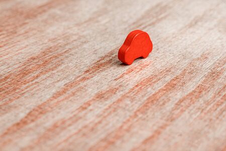 Tendering or competition for the contract. Red toy cars on wooden background. Equal conditions. Level playing field. Competition, contest background. Singularity, individuality concept. Tender ideaの写真素材