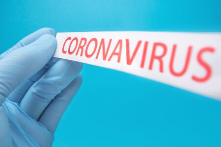 Coronavirus print on blue medical background. Covid-19の写真素材