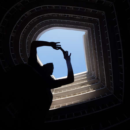 Photographer in big city. Man taking a picture on mobile in urban city. Modern round building with...