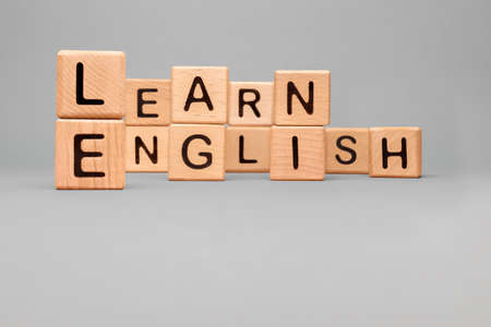 Education learning English letter block toy cubes. Speak English Learn word wooden block concept foreign language tutoring. Icon Learn English word block wooden cubes concept language courses trainingの写真素材