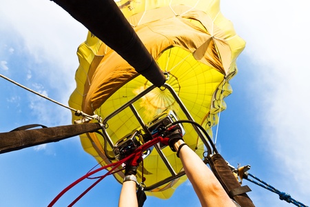 A hot air balloon taking off.  Partenza di una mongolfiera vista dal cesto.の写真素材