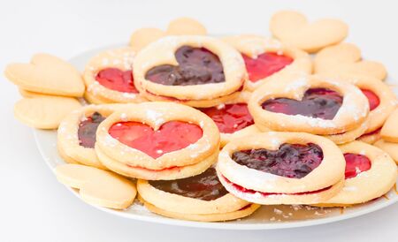 Plate of shortbread with jam heart-shaped の写真素材