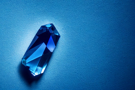 Quartz blue crystal stone. Macro studio photography on polished blueish transparent gemstone. isolated glossy mineral for health and spiritual balance or luxury aqua geological gemの素材