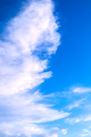 Blue cloudy sky background with dramatic colorful clouds, vast cloudy sky landscapeの写真素材