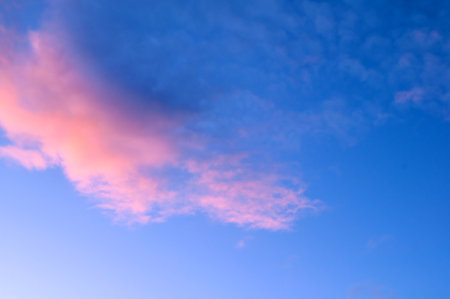 Sunset sky background with pink, purple and blue dramatic colorful clouds, vast sunset sky landscapeの写真素材