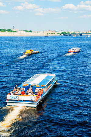 St Petersburg, Russia - June 6, 2019. Water area of the Neva river and floating touristic sailboats in St Petersburg, Russia. Summer travel landscape of St Petersburg Russiaのeditorial素材