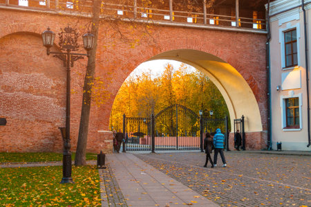 Veliky Novgorod, Russia - October 9, 2017. Main entrance to Novgorod Kremlin and tourists walking in the Novgorod Kremlin park in Veliky Novgorod, Russiaのeditorial素材