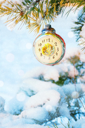 New Year background, New Year glass Christmas toy in the form of clock showing the New Year Eve, on...