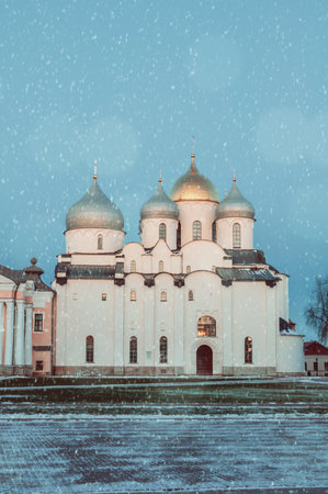 St Sophia Cathedral by winter night under the falling snow in Veliky Novgorod, Russia, winter...