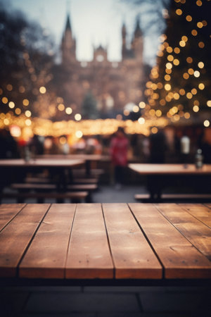 Empty wooden table in front of blurred background of christmas market in city.の素材
