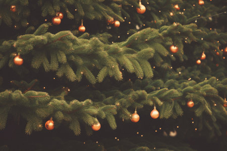 Christmas tree with gold balls and bokeh lights. Vintage toned.の素材