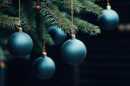Blue Christmas balls hanging on a branch of a Christmas tree. Christmas background.の素材