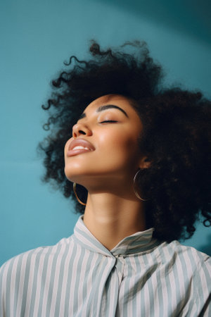 Portrait of a beautiful African American woman with curly hair.の素材