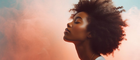 Beautiful young African American woman with afro hairstyle.の素材