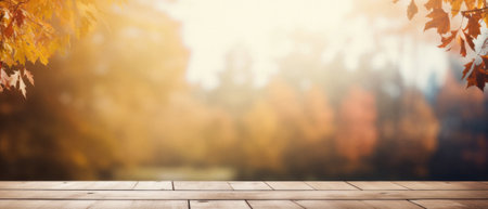 Empty blank wooden table fall background with autumn trees orange yellow color leaves backdrop forest or park nature scene abstract blurred bokeh tabletop for product display desk mockup. Copy space.の素材