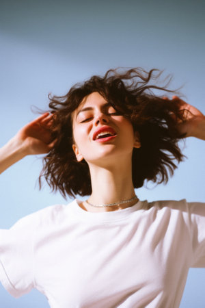 Young happy woman, smiling gen z girl model wearing tshirt looking at camera standing on color background. Face skin care cosmetics makeup, fashion ads. Beauty portrait. White t-shirt mock up template.の素材