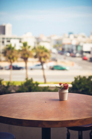 Wooden table ocean bokeh background, empty wood desk surface product display mockup with blurry sea water sunny beach abstract summer travel backdrop advertising presentation. Mock up, copy space.の素材