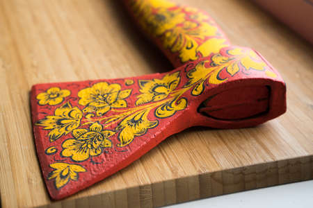 axe in Khokhloma. An axe painted in Russian folk style. Russian traditionsの写真素材
