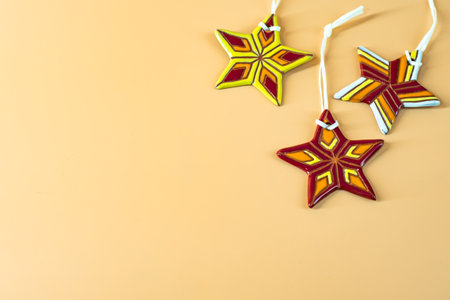 Ceramic Christmas stars on beige background