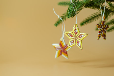 Ceramic Christmas stars on fir branches