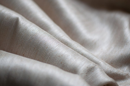 Folds of textured fabric. Background of fabric.