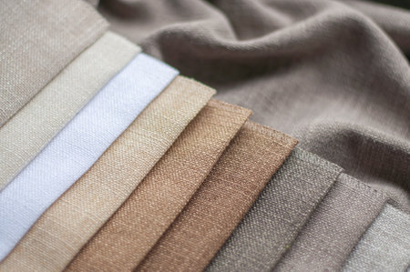 Fabric in milk, beige and gray colors for home textiles and curtains. The color palette of fabric...