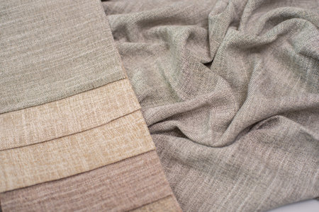 The color palette of fabric for curtains. Fabric in milky, gray and brown colors