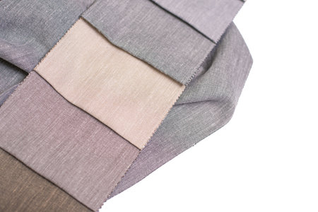 Samples of milk, beige and gray fabric for curtains with black back. Samples of fabric that does not...
